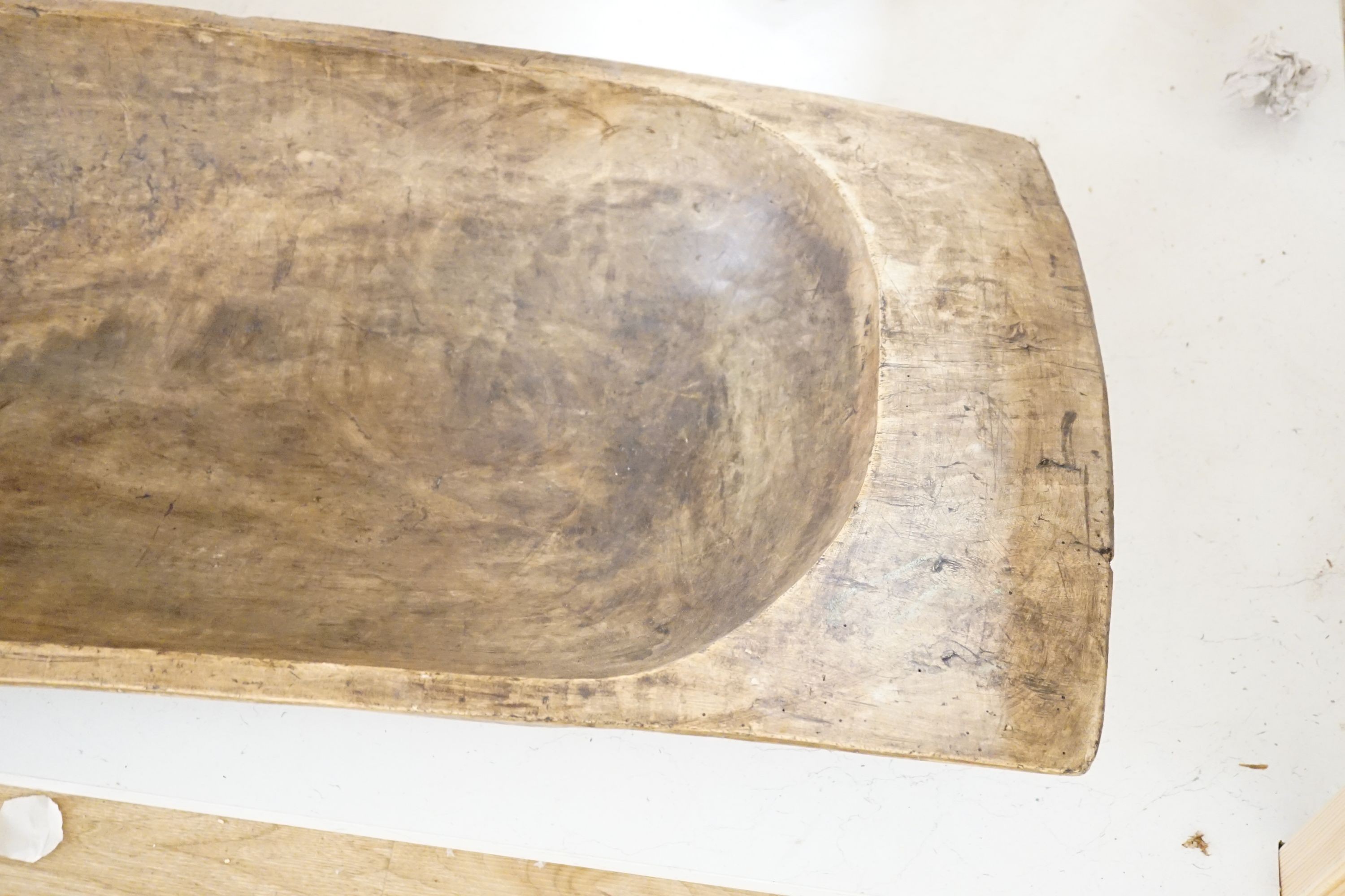 A large 19th century European fruitwood dough trough hewn from a single piece of wood. 132cm x 49cm. *This lot is being sold in aid of the charity Dogs Trust UK with 100% of the hammer price going to the charity